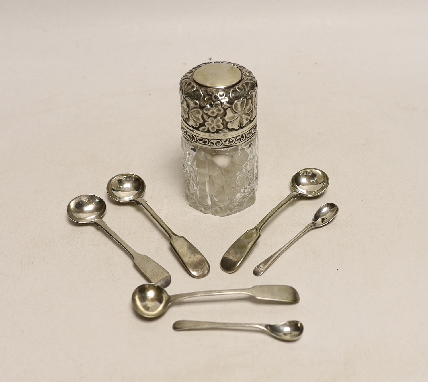 Four silver mustard ladles, including two 19th century, two plated ladles and an Edwardian silver mounted glass salts jar, London, 1905, 94mm.